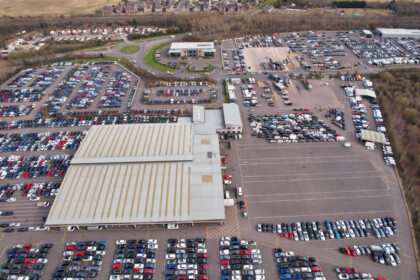 High Angle Aerial View Of Massive Huge Car Park Of Auctions Of England